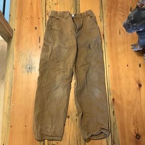Carharrt work jeans. Used (black stain on left leg)